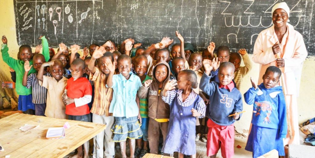 image of school children waving